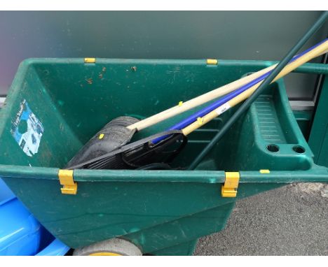 Plastic wheelbarrow and garden tools contents