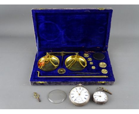 Cased set of portable scales and weights and two vintage silver cased pocket watches