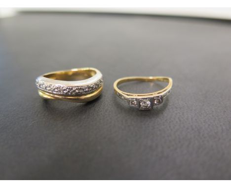 A diamond three-stone ring - Size K 1/2 - Together with a bi-colour diamond twist ring - Size L - Both with marks indicating 