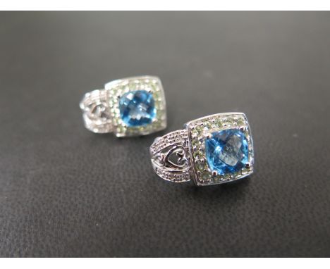A pair of topaz and green-gem cluster earrings - Stamped 14K - Length 2cms - Weight approx 8.2gms
Condition Report: Good to f