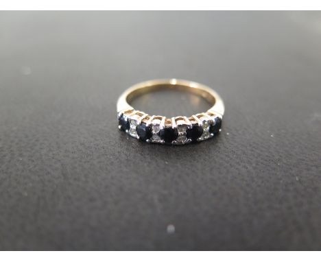 A 9ct gold sapphire and diamond half-circle ring - Partial hallmark - Ring size N - Weight approx 2.0gms
Condition Report: Go
