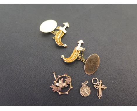 A pair of scimitar cufflinks - Test as high carat gold - Weight approx 8.0gms - Together with three pendant/charms - With mar