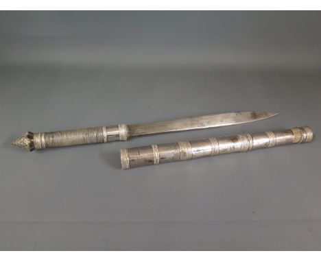 An Indian white metal dagger with white metal scabbard - overall length 42cm - Length of blade 25cm