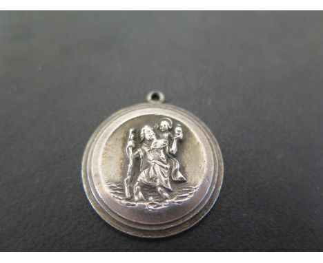 GEORG JENSEN - A silver St Christopher pendant - Hallmarked London, 1975 - Diameter 2.7cms - Weight approx 13.9gms
Condition 