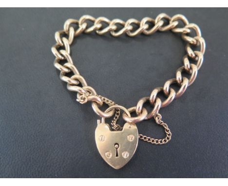 A 9ct gold curb-link bracelet - To the padlock clasp - Hallmarked Sheffield - Length 19cms - Weight approx 42.0gms
Condition 