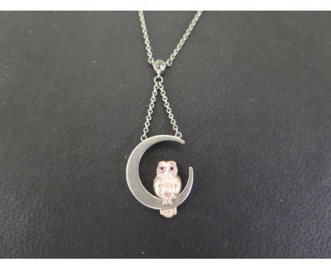 A paste-set owl and crescent moon pendant - Tests as silver - Length 43cms - Weight approx 3.1gms
Condition Report: Good to f