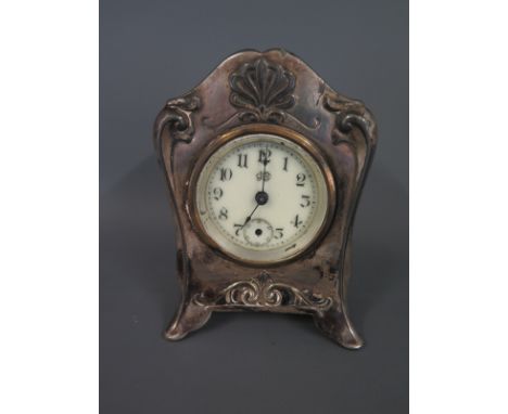 An early 20th century Art Nouveau mantel clock by Jennings Brothers in white metal
Condition report: As found condition with 