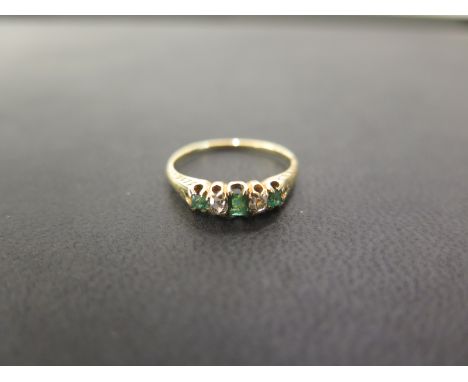 An emerald and diamond five-stone ring - Tests as higher carat gold - Ring size L - Weight approx 2.1gms
Condition Report: Go