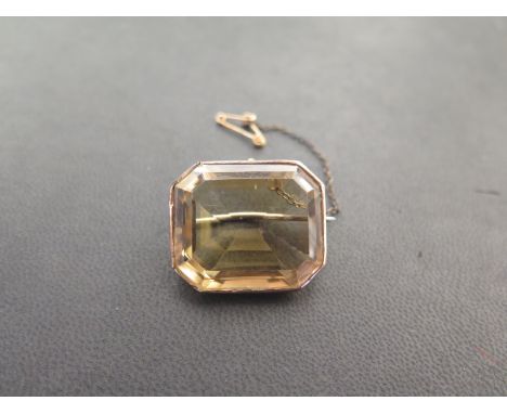 A smokey quartz brooch - The octagonal gem measuring approx 28x23x13.2mms - Frame tests as gold - Total weight approx 17.4gms