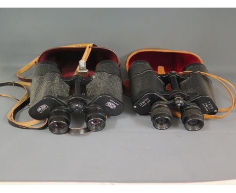 A pair of Carl Zeiss Jena Jenoptem 7 x 50W multi-coated binoculars in leather case and a pair of Zenith 7 x 50 binoculars in 