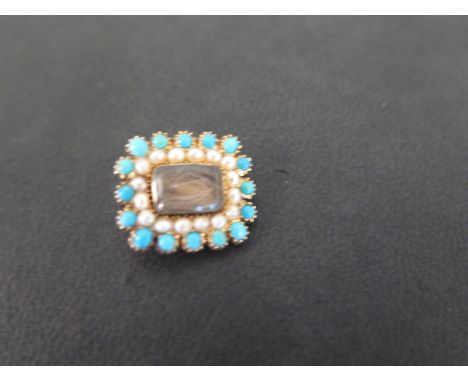 A late 19th/early 20th century gold turquoise and seed pearl memorial brooch - With central hair panel - Width approx 1.8cms 
