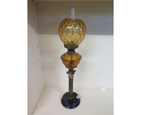 An Edwardian lamp having mottled glass shade spherical above reservoir and coronation column upon plinth - Total height 77cm 