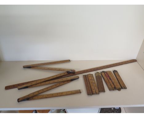 Seven folding wooden rulers and a one piece yard stick - four are warranted boxwood by Rabone of Birmingham