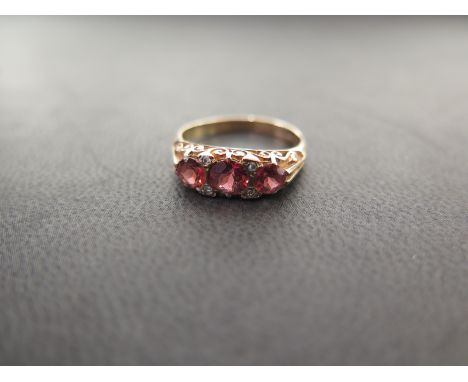 A 9ct gold garnet and diamond dress ring - Hallmarked Birmingham - Ring size O - Weight approx 2.8gms
Condition Report: Good 