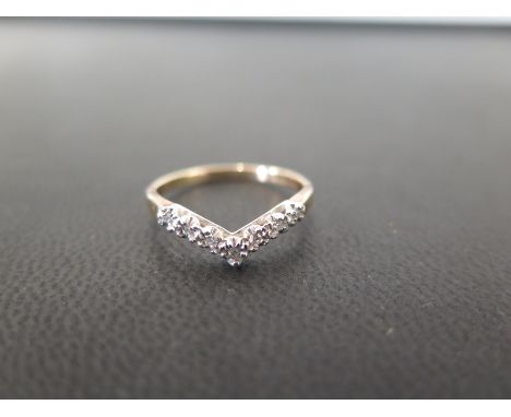 A 9ct gold diamond chevron-shape ring - Hallmarked London - Ring size M - Weight approx 1.3gms
Condition Report: Good - With 