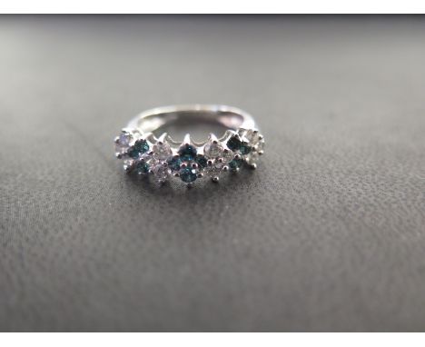 A diamond and blue diamond cluster dress ring - Stamped 14K - Ring size N - Weight approx 3.5gms
Condition Report: Good - Wit