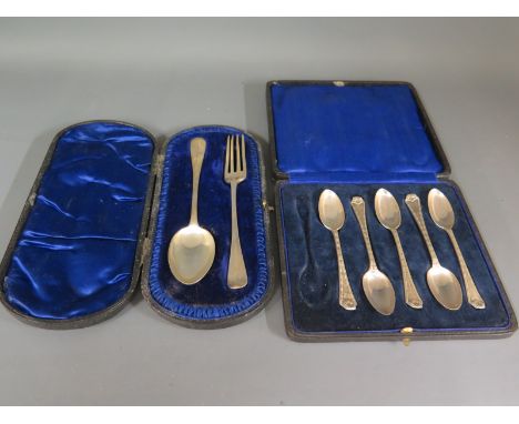 A cased silver hallmarked Christening fork and spoon and five silver hallmarked cased teaspoons - London 1909 -10 and London 