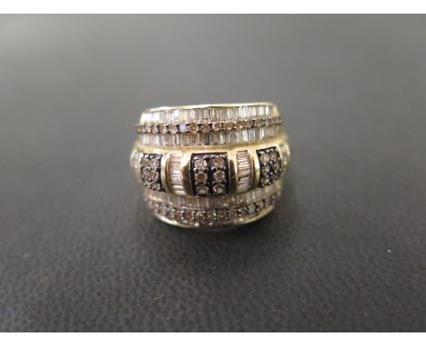 A 9ct gold diamond band ring - Set throughout with baguette and single-cut diamonds - Hallmarked Birmingham - Ring size O - W