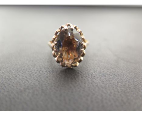 A 9ct gold smokey quartz single-stone ring - Hallmarked London - Ring size O - Weight approx 3.8gms
Condition Report: Good - 