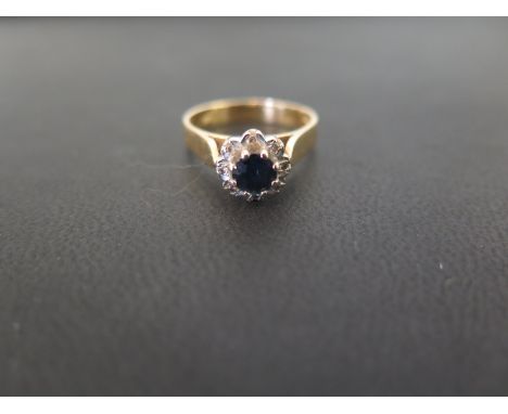 An 18ct gold sapphire and diamond cluster ring - Hallmarked London - Ring size N - Weight approx 4.3gms
Condition Report: Goo