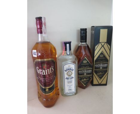 A 70cl bottle of Bombay London Dry Gin, a 1 litre bottle of Grants Scotch Whisky 40% volume and a 70cl bottle Antiquary 12 ye