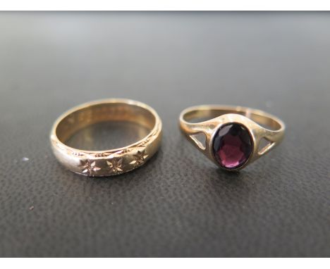 A 9ct gold garnet single-stone ring - Hallmarked Birmingham - Together with a diamond-set band ring - Hallmarked London - Bot