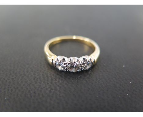 An 18ct gold brilliant-cut diamond three-stone ring - Accompanied by a valuation from Cellini dated 3/10/15 stating the estim