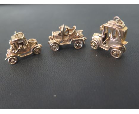 Three 9ct gold charms/pendants - In the form of motor cars - Hallmarked London - Widths 2-2.5cms - Total weight approx 22.4gm