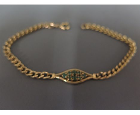 A 9ct yellow gold and emerald bracelet, the central eye shaped cartouche decorated with emeralds on link chain - Weight appro