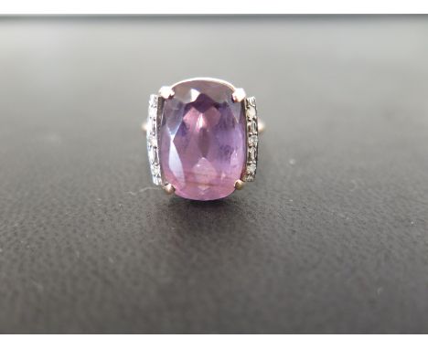 An amethyst and diamond dress ring - Tests as 9ct gold - Ring size P 1/2 - Weight approx 4.9gms
Condition Report: Good - With