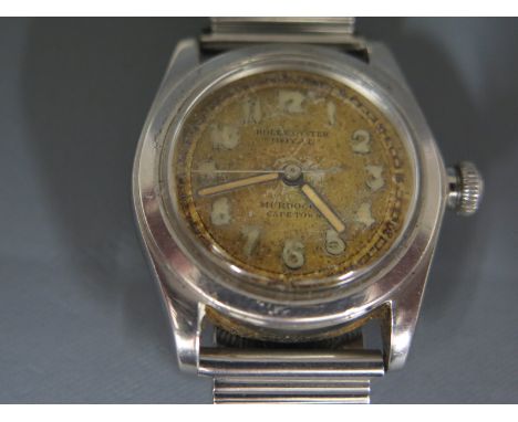 A circa 1940 Rolex Royal wristwatch Arabic numerals to mottled dial, retailer mark to bottom of face, Murdock Cape Town - no 