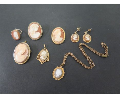 A group of shell cameo jewellery - To include a ring, pair of earrings and a pendant which test as higher carat gold - Weight