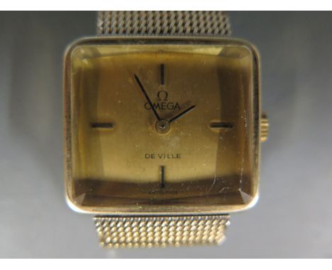 A ladies Omega De-Ville golf plated wristwatch, baton markers to 12, 3, 6 and 9 o'clock on plated Omega strap - light scratch
