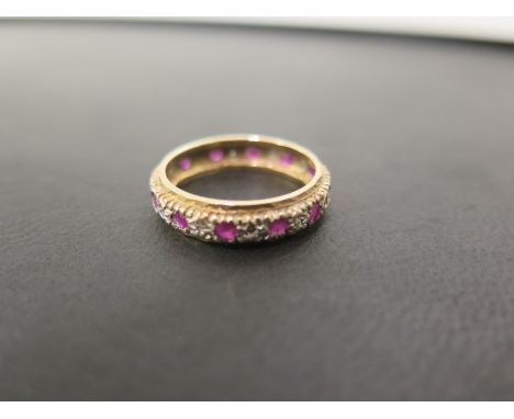 A 9ct gold ruby and diamond full-circle ring - Hallmarked Birmingham - Ring size P 1/2 - Weight approx 3.2gms
Condition Repor