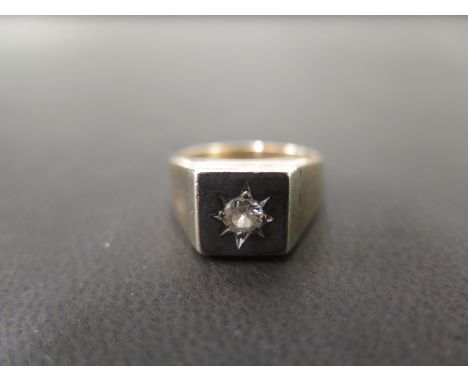 A 9ct gold diamond signet ring - Estimated diamond weight 0.25ct - Hallmarked London - Ring size M 1/2 - Weight approx 5.5gms