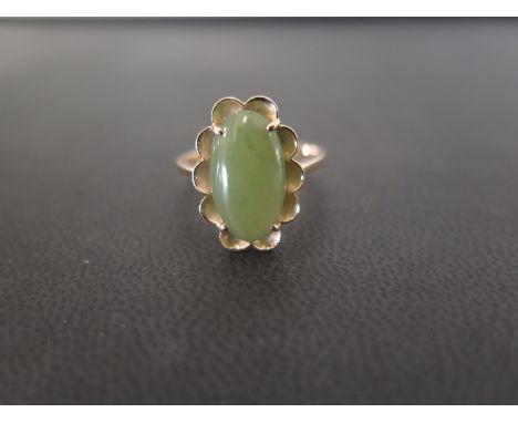 A green-gem single-stone ring - Stamped 14K - Ring size P 1/2 - Weight approx 4.2gms
Condition Report: Good - With light surf