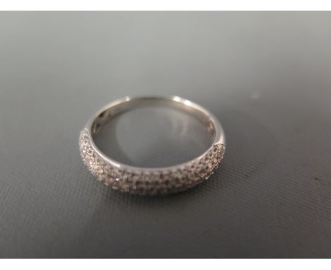 A pave-set diamond band ring - Stamped 18K - Ring size Q - Weight approx 2.8gms
Condition Report: Good - With light surface s