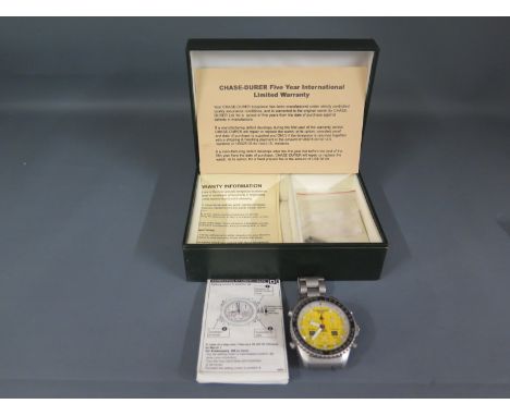 A Chase-Durer chronograph with yellow face, baton markers date aperture to 4 o'clock, alarm aperture to 8 o'clock dials at 2,