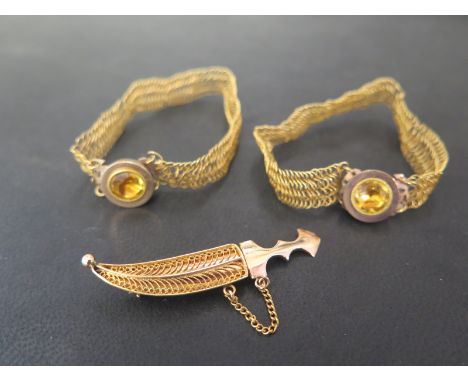 A scimitar brooch - With filigree detail - Together with two woven bracelets with gem-set collet clasps possibly Georgian- Al