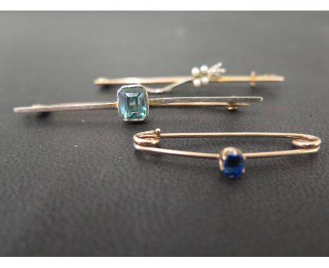 Three bar brooches - To include sapphire, zircon and seed pearl - One stamped 15ct, one stamped 9ct, one tests as 9ct gold - 