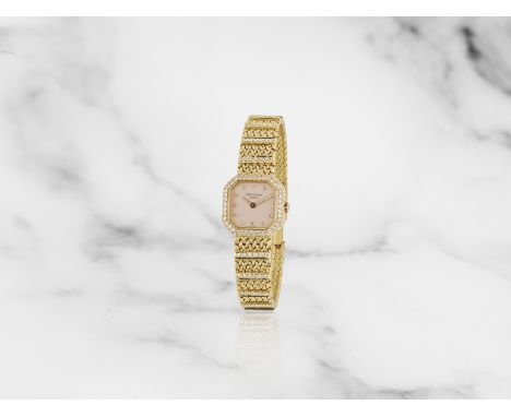 Patek Philippe. A lady's 18K gold and diamond set manual wind bracelet watchPatek Philippe. Montre bracelet de dame en or jau