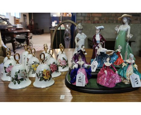 A collection of the Summer Collection ceramic floral bells, together with various figurines; Nao and a set of six Royal Doult