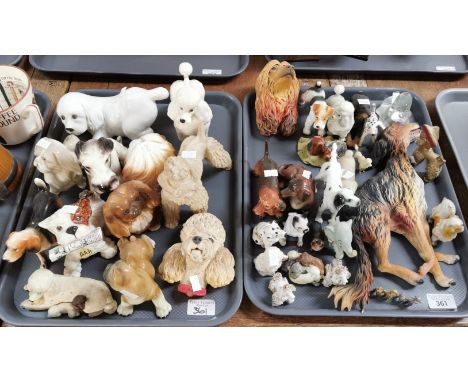 Two trays of mainly ceramic dog studies: Pekinese, Poodles, Dalmatians, Retrievers, composition dogs, onyx dog studies etc. (