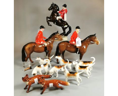 Collection of Beswick Huntsmen on Horses, one model No 868, together with seven Hunting Hounds and two foxes. (12) (B.P. 21% 
