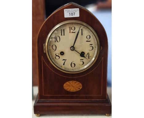 Edwardian inlaid mahogany lancet shaped mantel clock having Arabic face and two train movement striking on one gong. 32cm hig