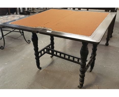 Victorian ebonised and inlaid folding and swivel card table, on baluster ring turned fluted legs and casters.  (B.P. 21% + VA