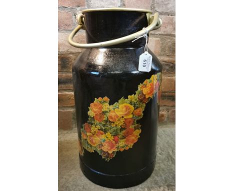 A vintage brass and aluminium churn with swing handle overall decorated with printed flowers and foliage. (B.P. 21% + VAT)