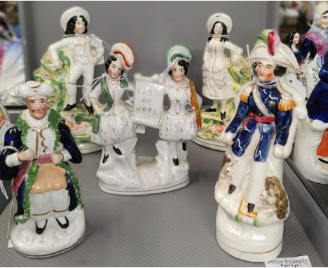 A collection of 19th century Staffordshire pottery and porcelaneous figures and similar to include; a pair of children on goa