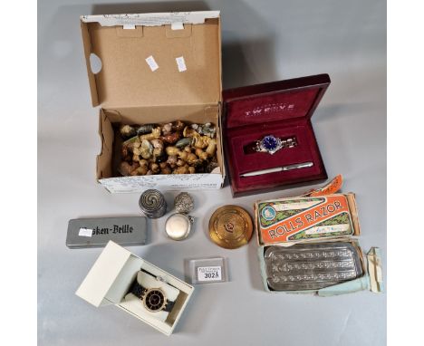 Box of oddments to include: collection of Wade Whimsies, Anne Klein wristwatch in original box, gold finish compact, Rolls Ra
