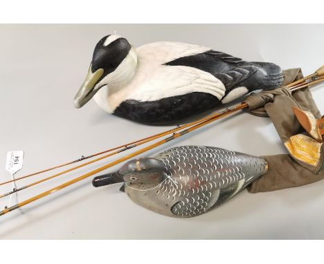 Two wooden decoy ducks, one marked to the underside Common Eider, Mike Wood, Collection of Kenny Everett. Together with a vin